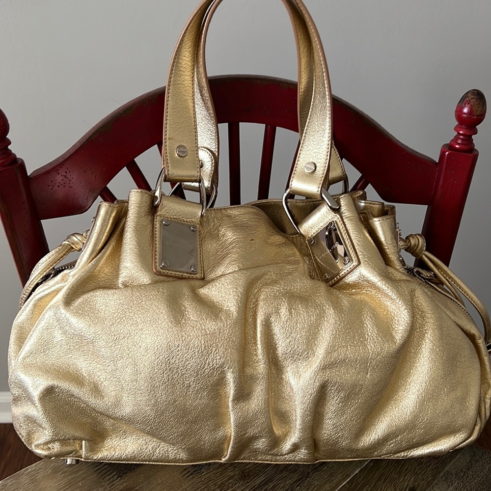 Michael Kors gold bag.